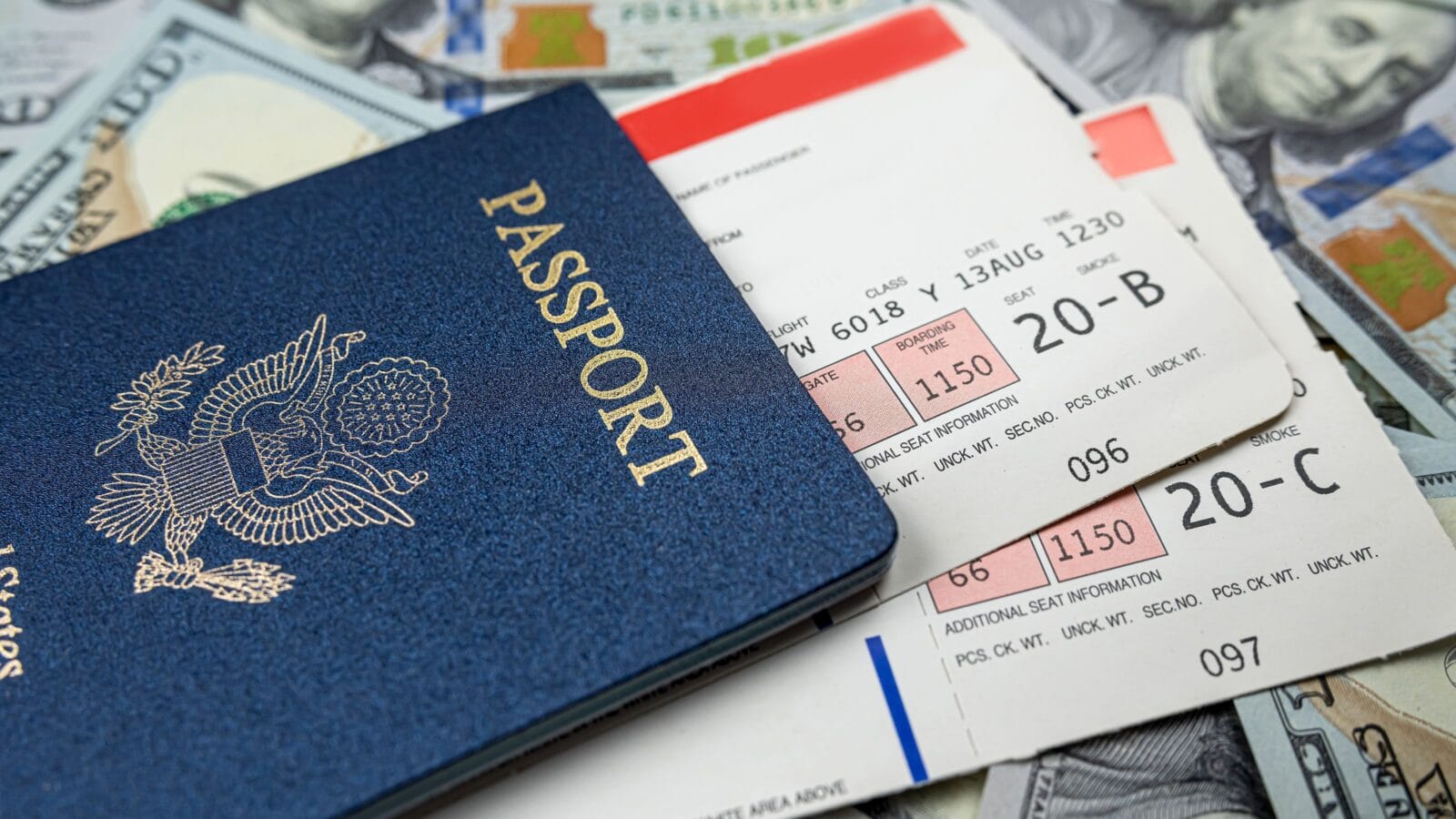 USA passport with travel ticket and dollar money.