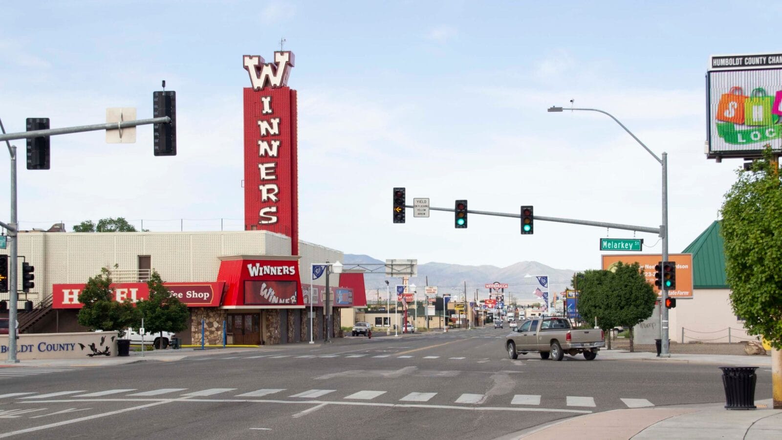 Main Street with Casinos and Traffic in Daylight or Daytime, Winnemucca, Nevada USA